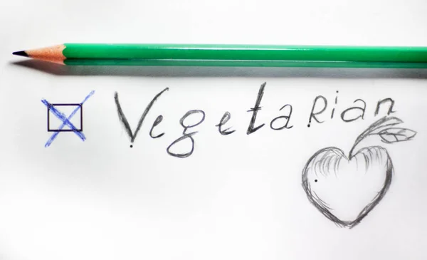 Questionnaire. corundas inscription VEGETARIAN with a cross on white paper painted apple. — Stock Photo, Image
