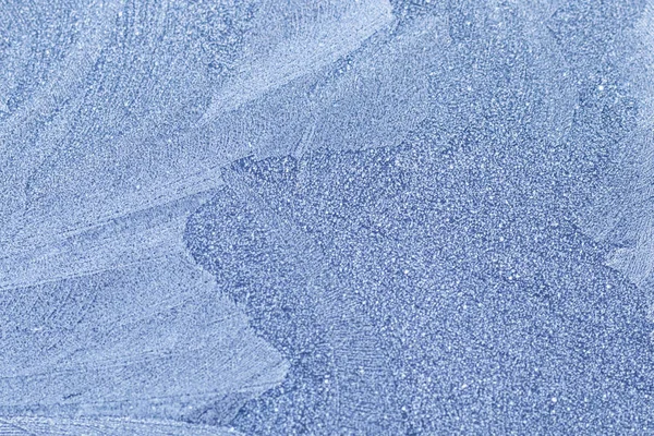 Textura. profundidad de campo poco profunda. enfoque suave. heladas sobre metal azul . —  Fotos de Stock