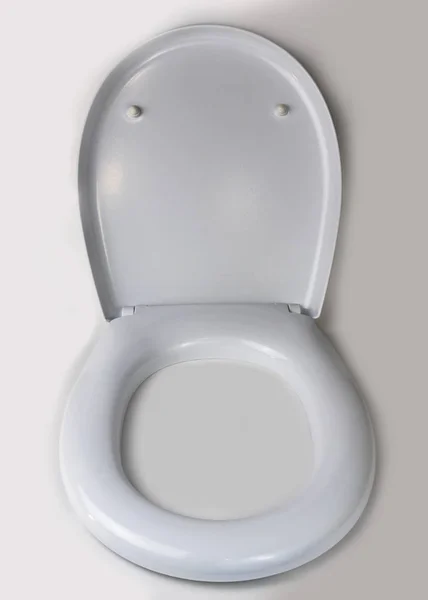 On a white background, a toilet lid. close-up. isolation. — Stock Photo, Image