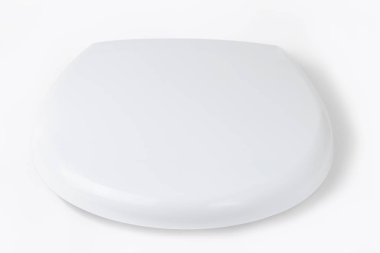 Beyaz bir arka planda, tuvalet kapağında. Yakın plan. yalnızlık.