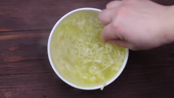 Close Hand White Plastic Fork Stirs Noodles Capacity Paper Soup — 비디오