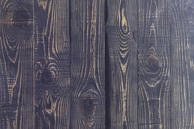 Tahtaların ahşap arka planı eski moda. koyu renklerde