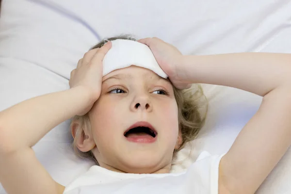 Girl White Hair Towel Her Forehead She Holds Her Head — Stock Photo, Image