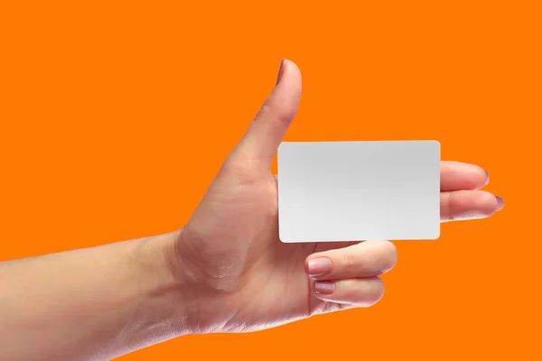 Left Female Hand Hold Blank White Card Mock-up. SIM Cellular Plastic NFC Smart Tag Call-card Mock Up Template. Credit Namecard or Transport Ticket. Christmas Store Discount Loyalty Gift. Copy space. — Stock Photo, Image