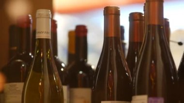 Glass bottles of imported wine in window of  Aromatniy Mir wine store.