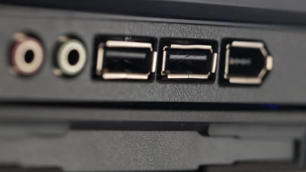 USB cable is inserted into socket. Black panel with colored connectors for micro — Stock Video