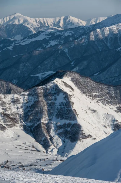 Snowy winter mountains in sun day. Georgia, from ski resort Gudauri. — Stock Photo, Image