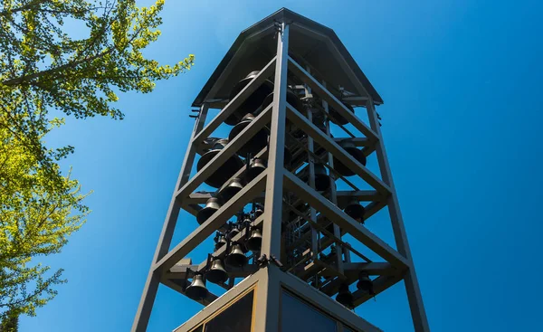 Tower with big metal bells in the park