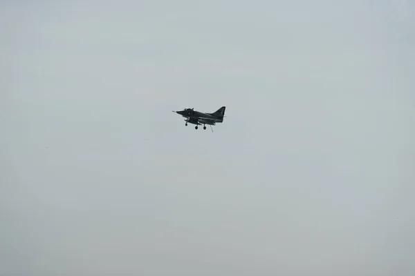 Airplane in the sky on a cloudy day — Stock Photo, Image