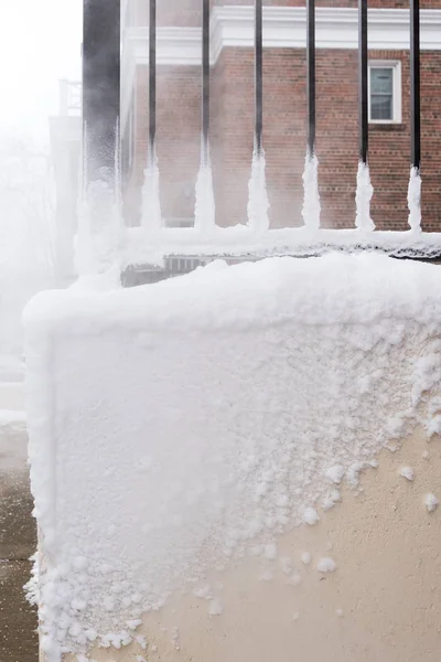 Building stairs covered in snow and frozen water