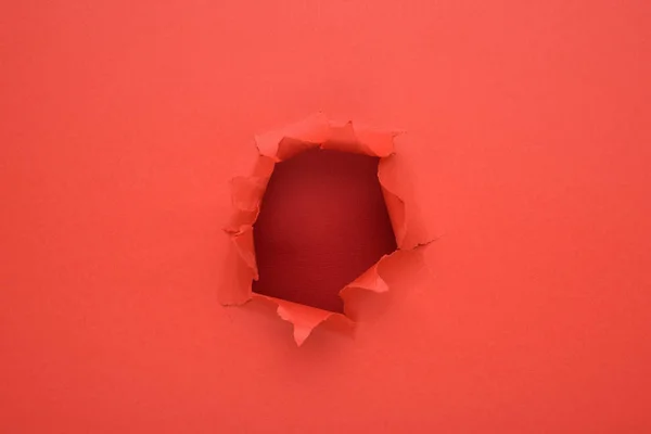 Torn red paper wall background. Copy space aside for your advertising and offer or sale content.