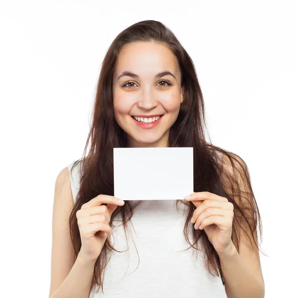 Happy young woman displaying at a blank signboard — Stock Photo, Image