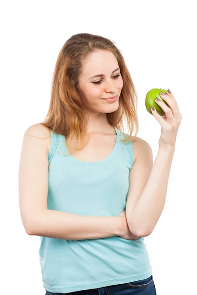 Mulher segurando uma maçã verde — Fotografia de Stock