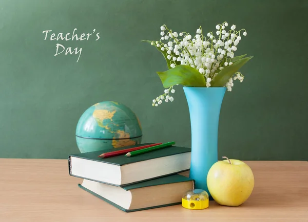 Still life with flowers, books and fruits. World Teacher's day concept