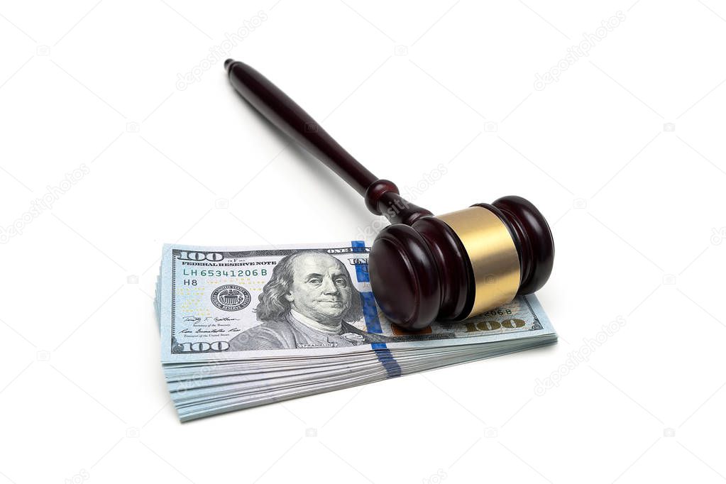 Judge gavel and money isolated on white background.