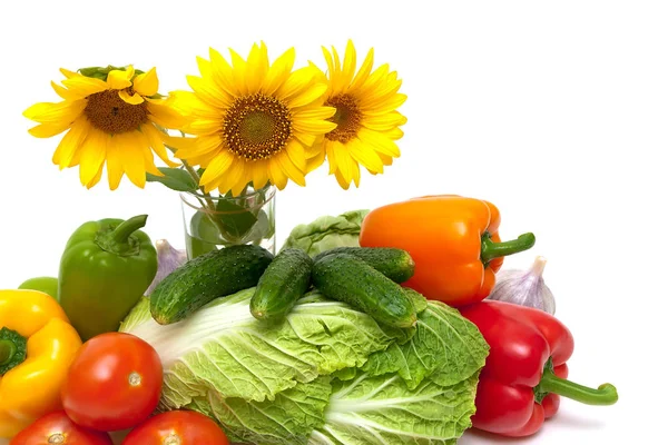 Vegetables and sunflower flowers on a white background — Stock Photo, Image