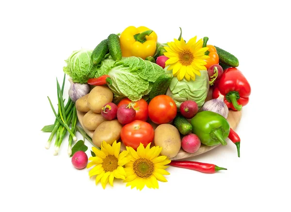 Fresh vegetables and blooming sunflowers on a white background — Stock Photo, Image