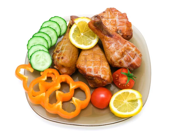 Smoked chicken legs with vegetables and lemon on white backgroun — Stock Photo, Image