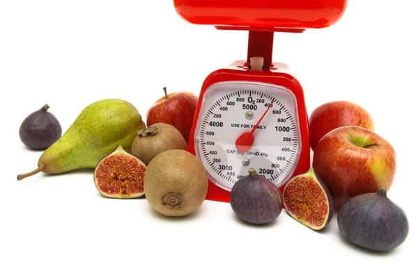 Kitchen scales and ripe fruits on white background — Stock Photo, Image