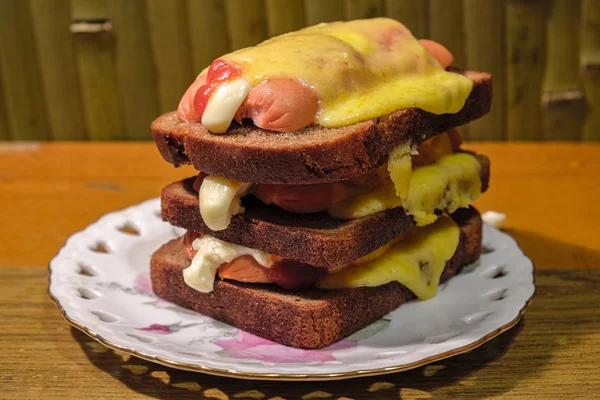 Hot sandwiches with sausage and cheese — Stock Photo, Image