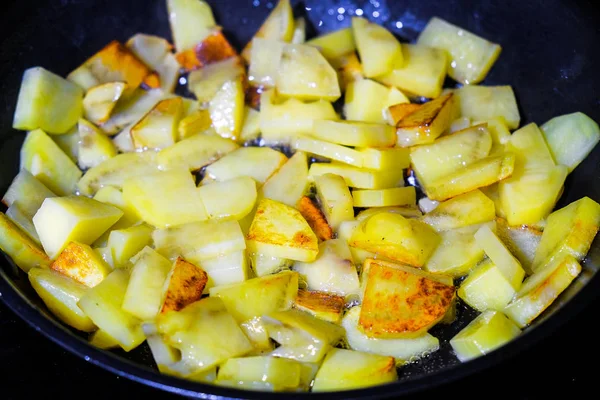 Fried potatoes in a pan — Stock Photo, Image