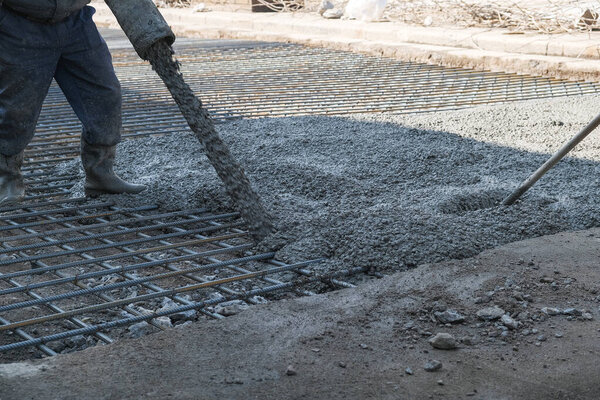 builders poured concrete at the construction site
