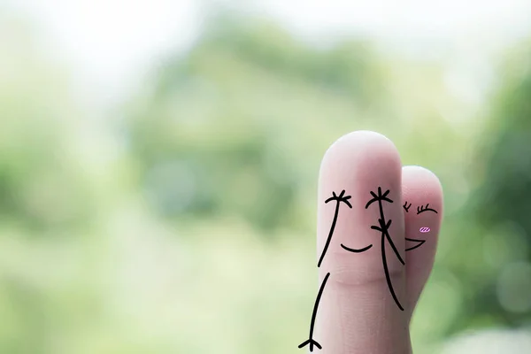 Finger art of a Happy couple. A man and a woman hug with pink hearts in the eyes. The concept of love at first sight.. — Stock Photo, Image