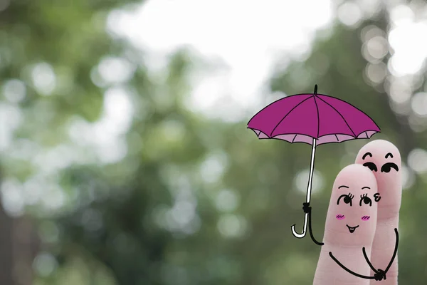 Dedo arte de una feliz Couple.rainy season.Boy y niña con paraguas Temporada de lluvias, Monzón, Lluvia , — Foto de Stock