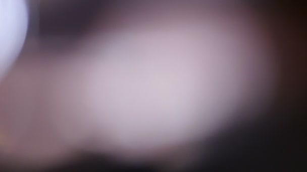 Fuite de lumière à portée de main. Film Burn Overlay Lifetime.Light impulsions et lueurs. belle fuite de lumière en Ultra Haute Définition sur fond sombre avec éruption de lentille réelle et fuite de lumière . 