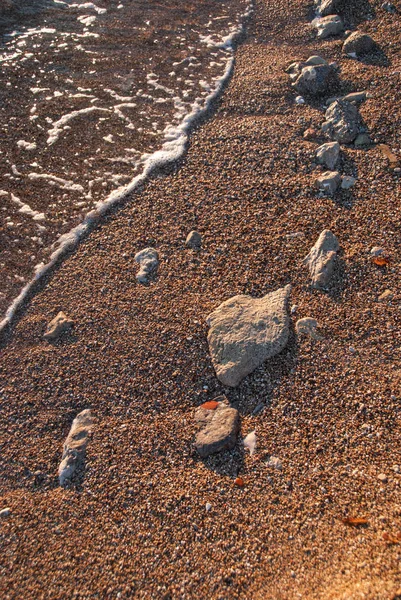 Beach sand and rocks — Stock Photo, Image