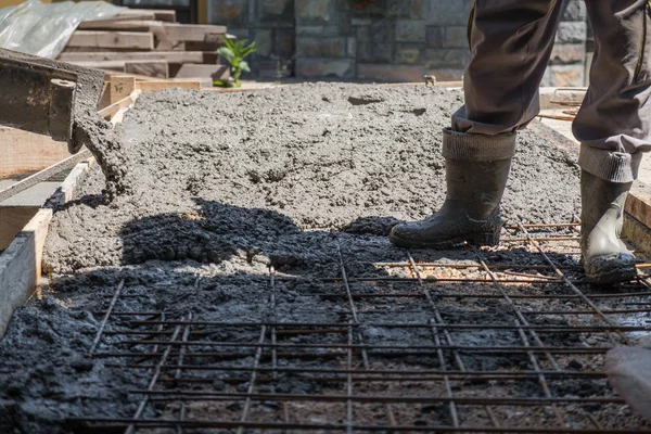 Worker standing on reinforcement mesh