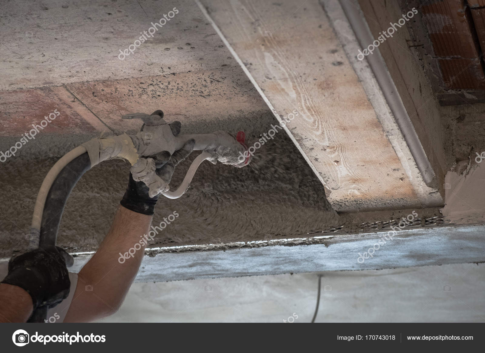 Construction Worker Applying Cement Plaster Stock Photo
