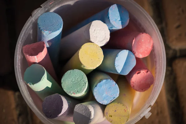 Bunch Coloring Chalks Plastic Bucket Sidewalk Children Creativity Conceptual Background — Stock Photo, Image