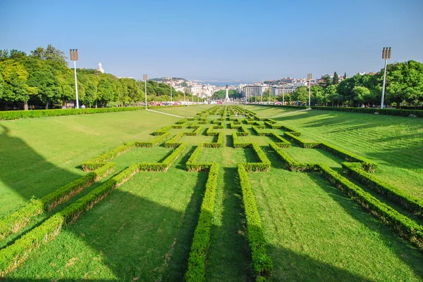Hedge maze park forming a long perspective to Marquis of Pombal square in Lisbon, Portugal
