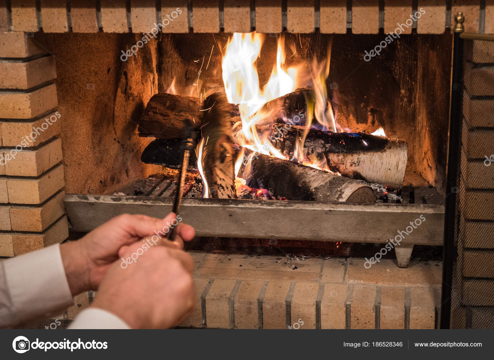 Man Putting Wood Logs Fireplace Stock Photo Maskalin 186528346 Man Putting Wood Logs Fireplace Stock Photo