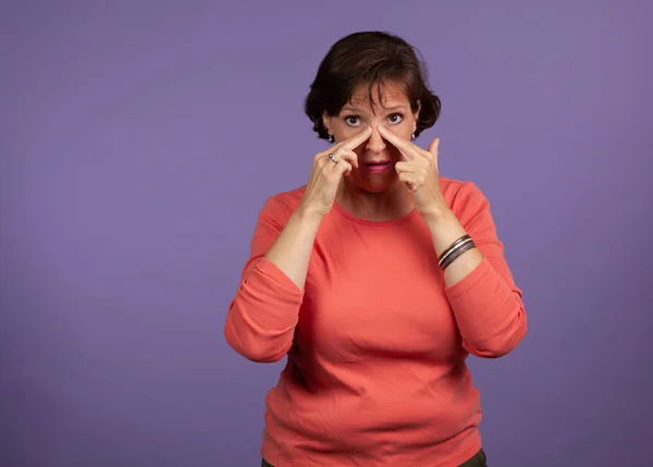 Middle Aged woman with sinus pain and pressure holding her head — Stock Photo, Image