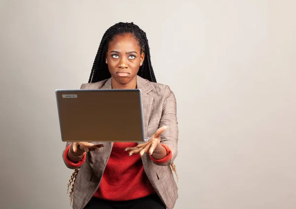 Woman gets angry and throws  laptop — Stockfoto