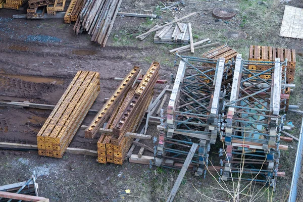 Heavy Construction Site with metal and wood supprts and scaffolds.