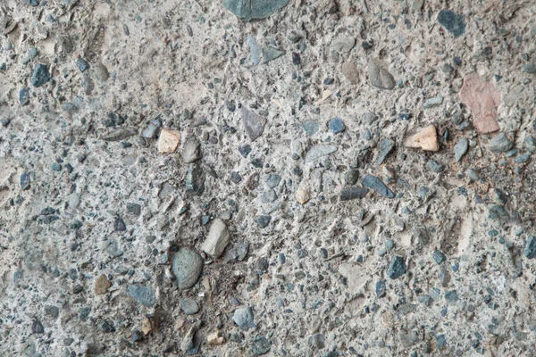 色の小石でテクスチャの壁 天然石でコンクリート壁 石の異なる灰色の背景 — ストック写真