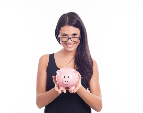 Vrouw in glazen houden piggy bank — Stockfoto