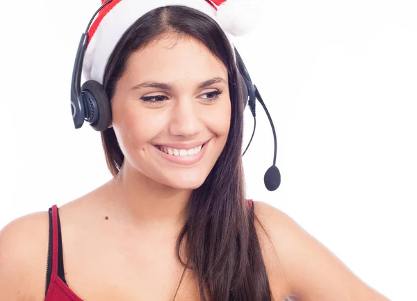 Lächelnde Frau mit Headset in Weihnachtsmütze — Stockfoto