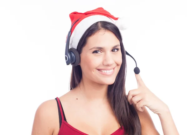 Smiling woman with headset in santas hat — Stock Photo, Image