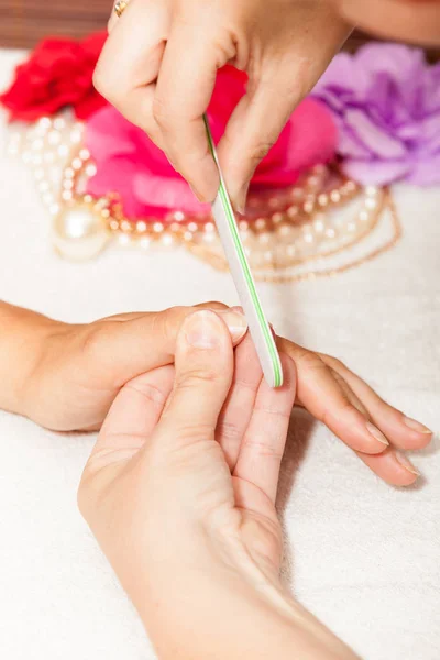 Beautician polishing  client nail — Stock Photo, Image