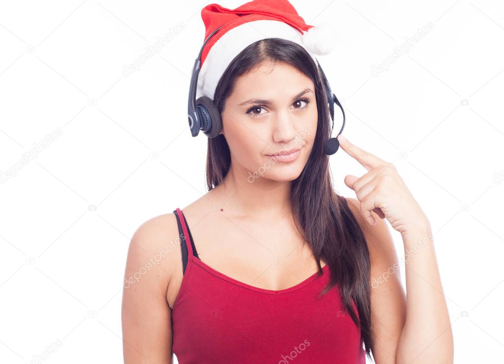 Christmas headset woman from telemarketing call center wearing red santa hat talking smiling isolated on white background.