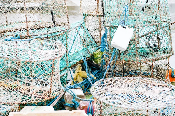 crab and lobster pots on a pontoon covered with morning frost