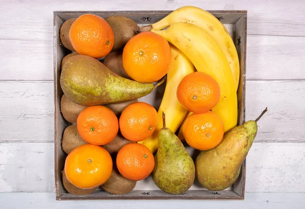 Bananas Conference Pears Tangerines Kiwis Placed Old Wooden Tray Background — 스톡 사진