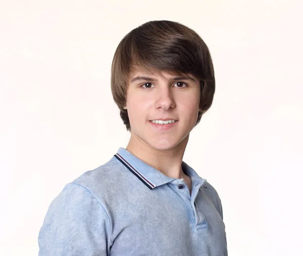 Portrait of young handsome man, teenage boy isolated on studio w — Stock Photo, Image
