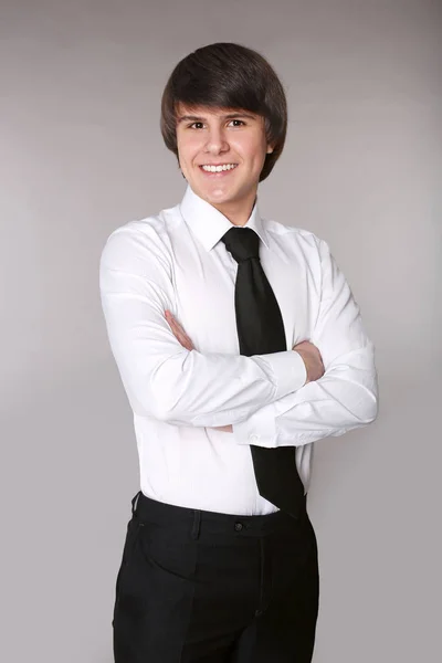 Cheerful toothy man with crossed arms in white shirt with black — Stock Photo, Image