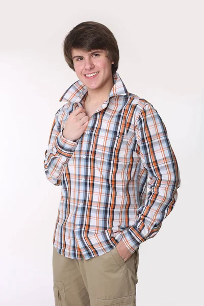 Cheerful toothy young man in checked shirt and smart casual wear — Stock Photo, Image