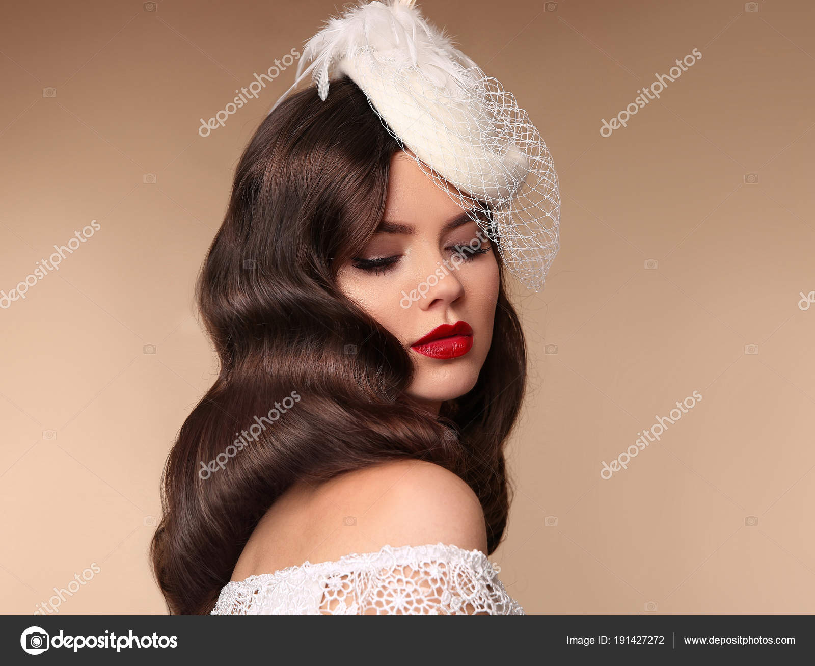 Portrait of an elegant enticing fashion female model wearing retro  black-and-white stripped blouse, red headband and updo hairstyle, looking  at the camera against dark background. Stock Photo | Adobe Stock